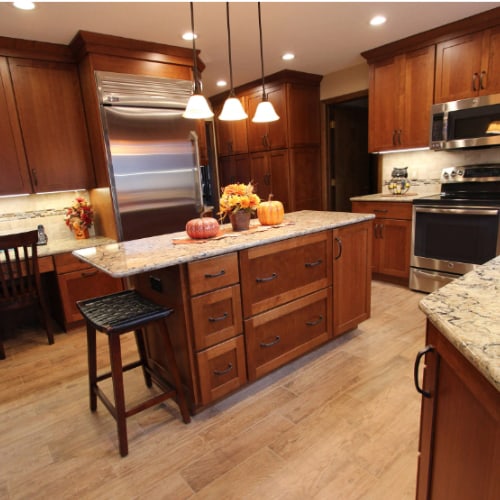 beige-wood-floors-with-cherry-cabinets