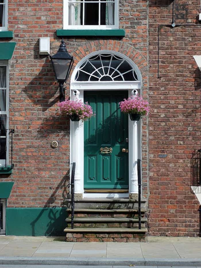 dark-green-front-door-brick-house
