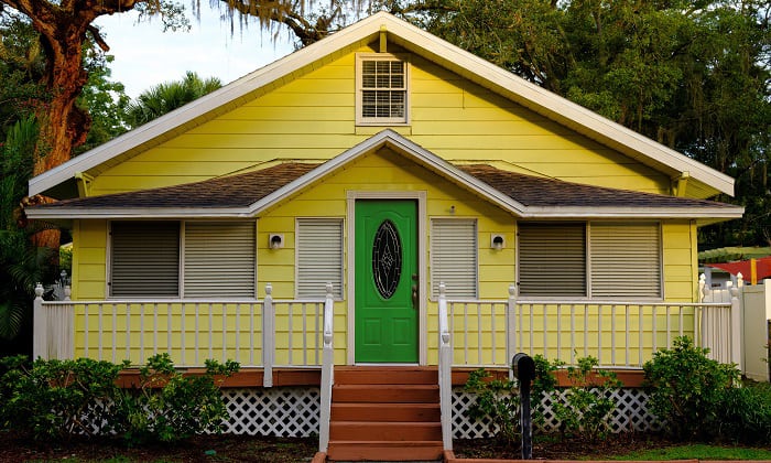 forest-green-front-door-color-for-yellow-house