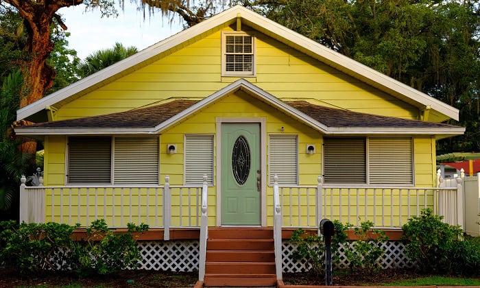 sage-green-front-door-color-for-yellow-house