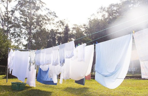 wring-clothes-by-clothesline