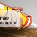how to caulk between baseboard and floor
