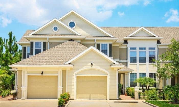 welcoming-yellow-front-door-for-a-tan-house