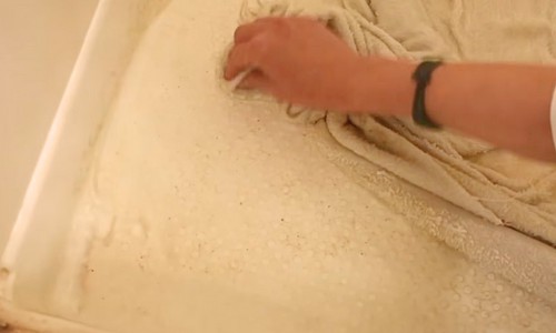scrubbing-the-floor-using-the-towels-or-cloth